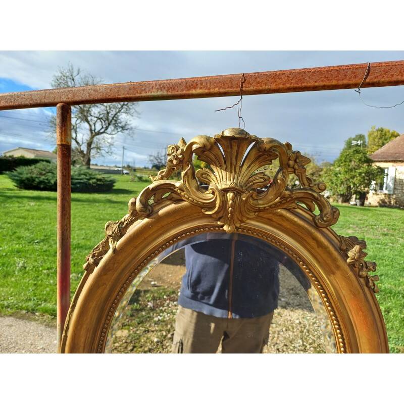 Miroir ovale en bois et stuc doré 19ème