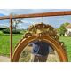 Miroir ovale en bois et stuc doré 19ème