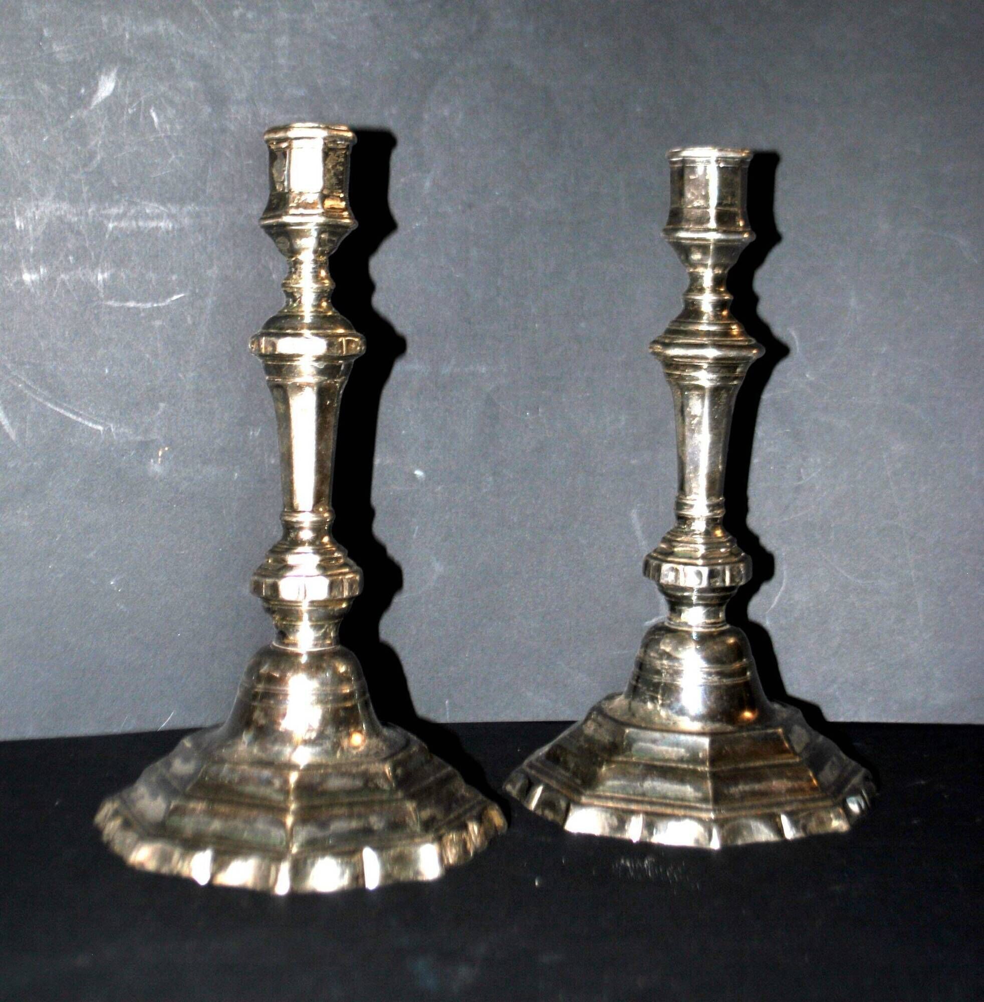 Pair of antique octagonal candlesticks in silvered bronze, Regency style.