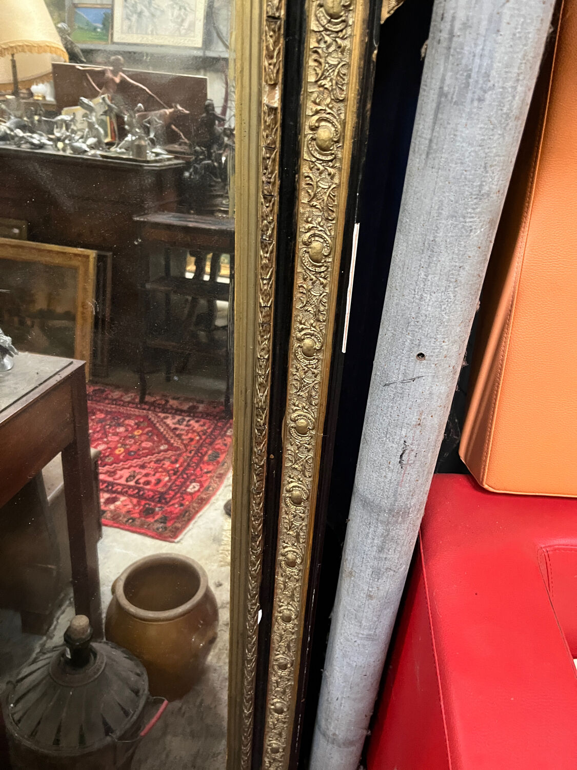 Large antique gilt mirror with scroll and shell decoration, 144 cm