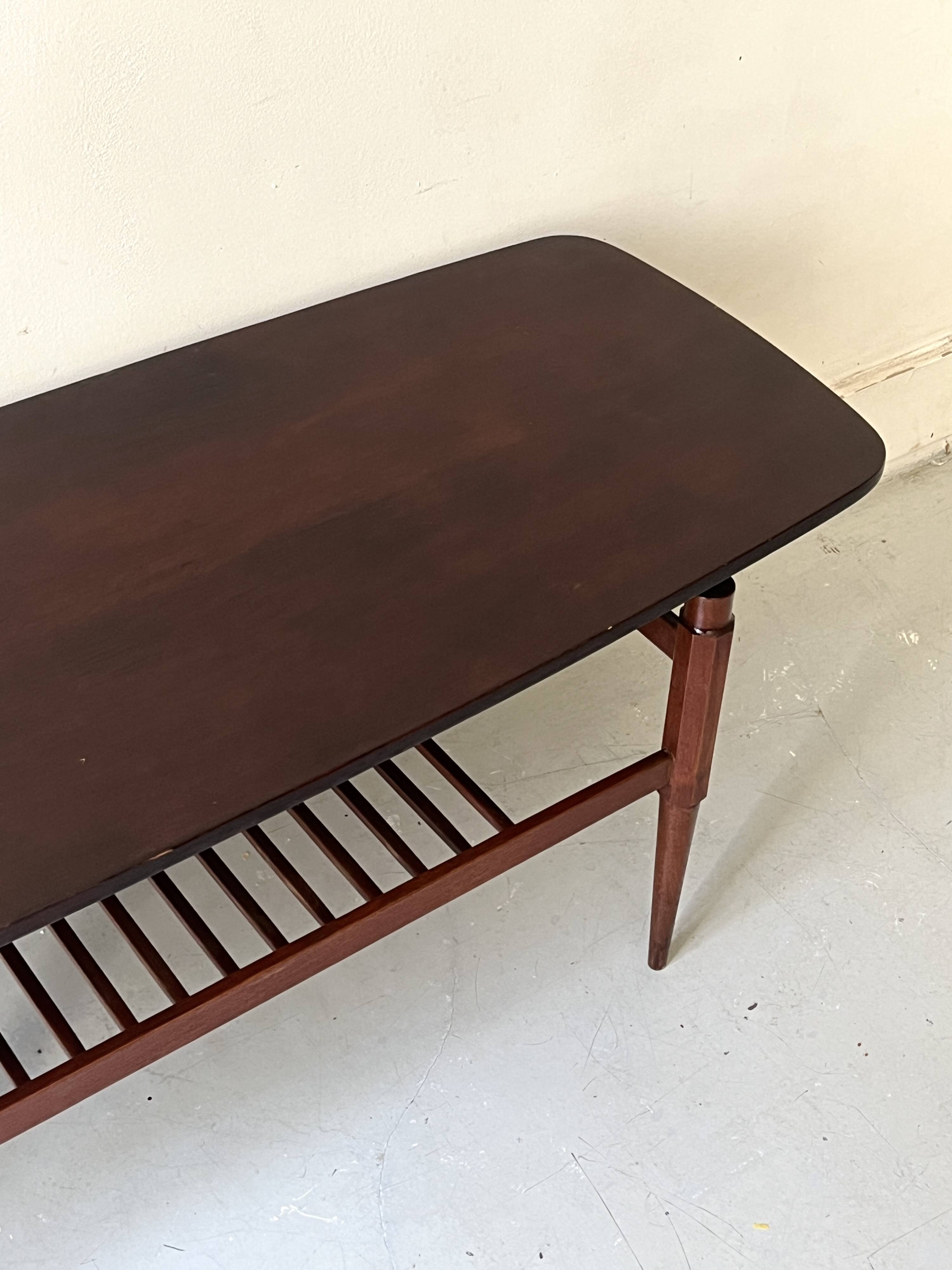 Danish teak coffee table with a double top, 1950s design.