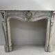 Louis XV style fireplace in veined white Carrara marble, 19th century.