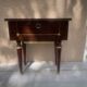 Nightstand with lovely mid-century style gold metal decor.