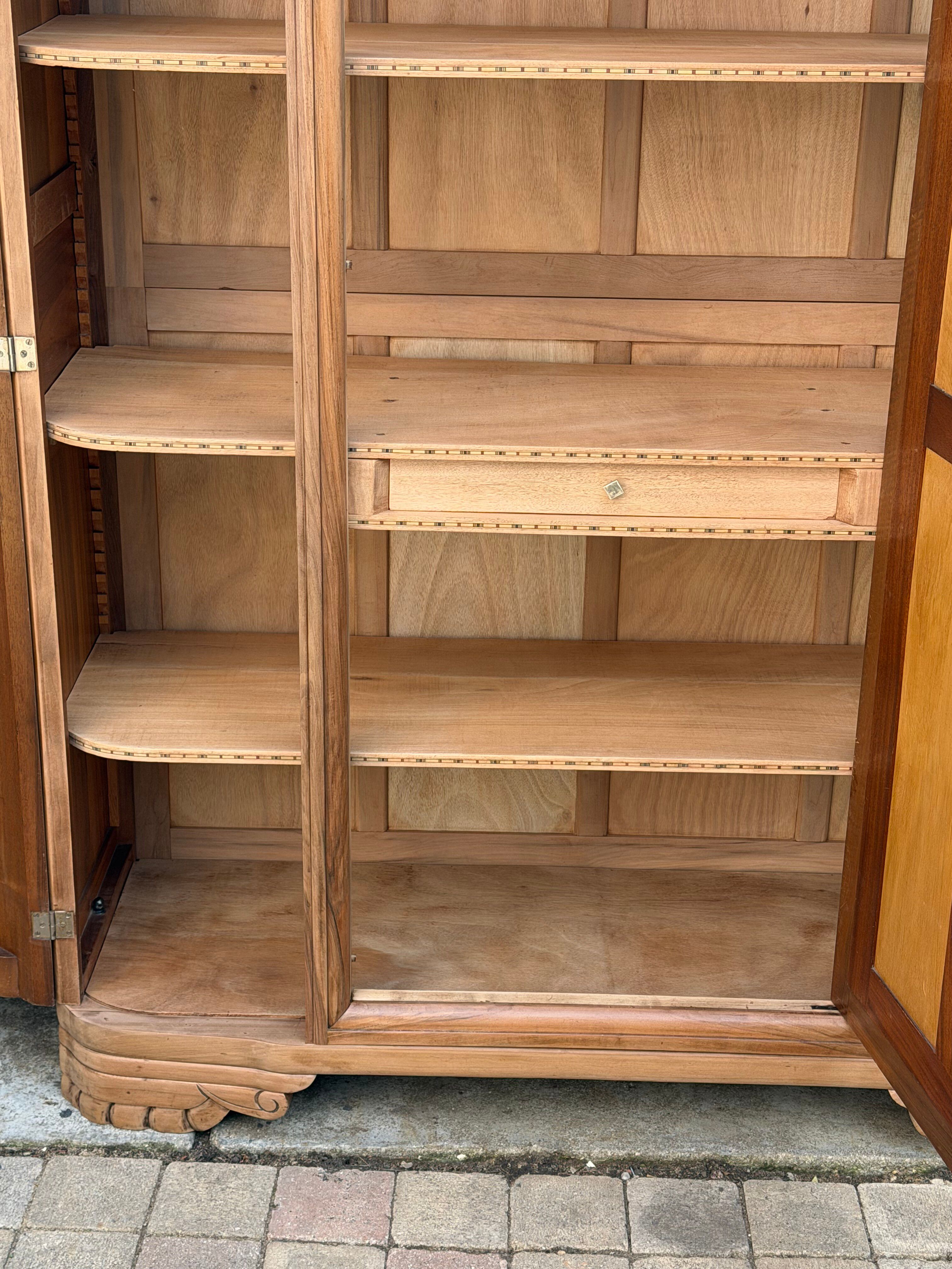 Art Deco wardrobe with bevelled mirror in solid raw walnut.