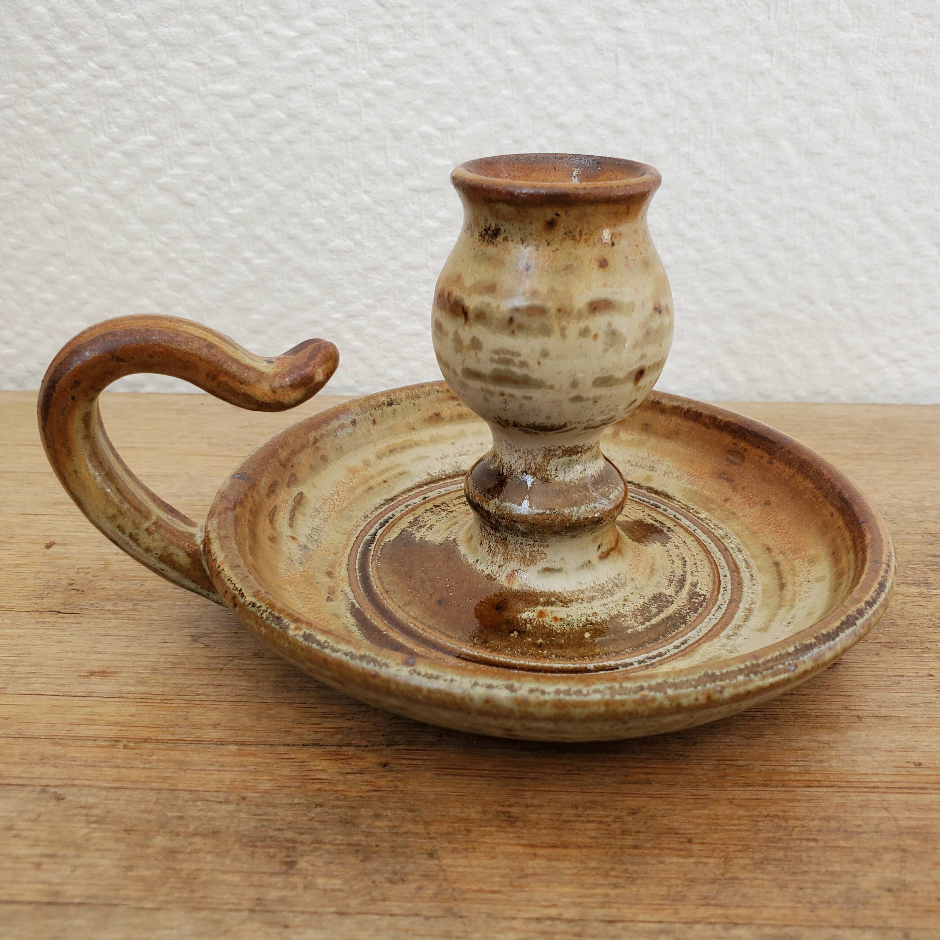 Sandstone candle holder called cellar rat