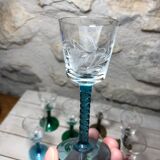 Antique and rare! Sold in a set of 12 colorful twisted stemmed glasses engraved with flowers and leaves