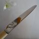 12 vintage stainless steel knives bone or bakelite sleeves in case