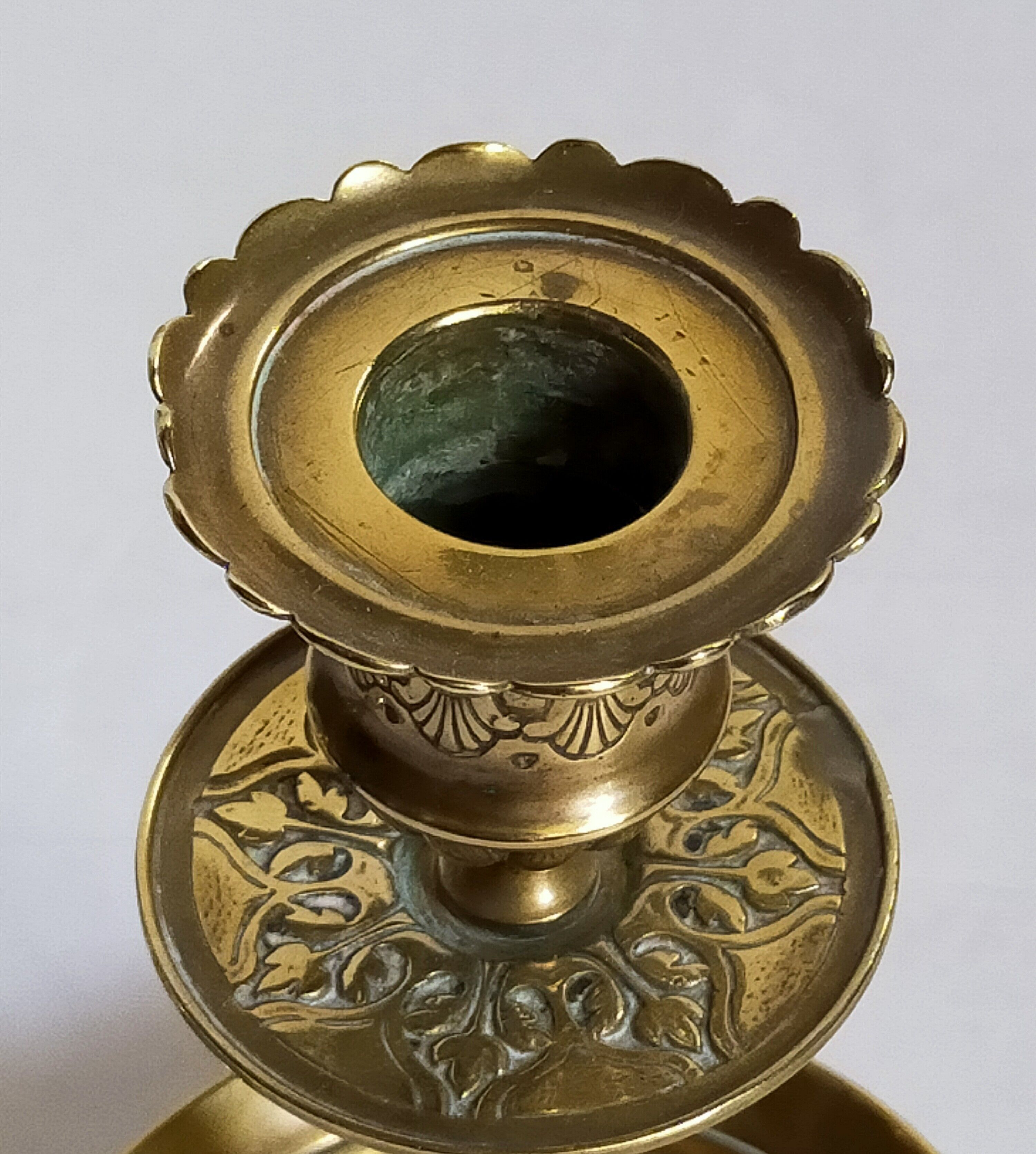 Duo of solid brass and gold metal candle holders worked old