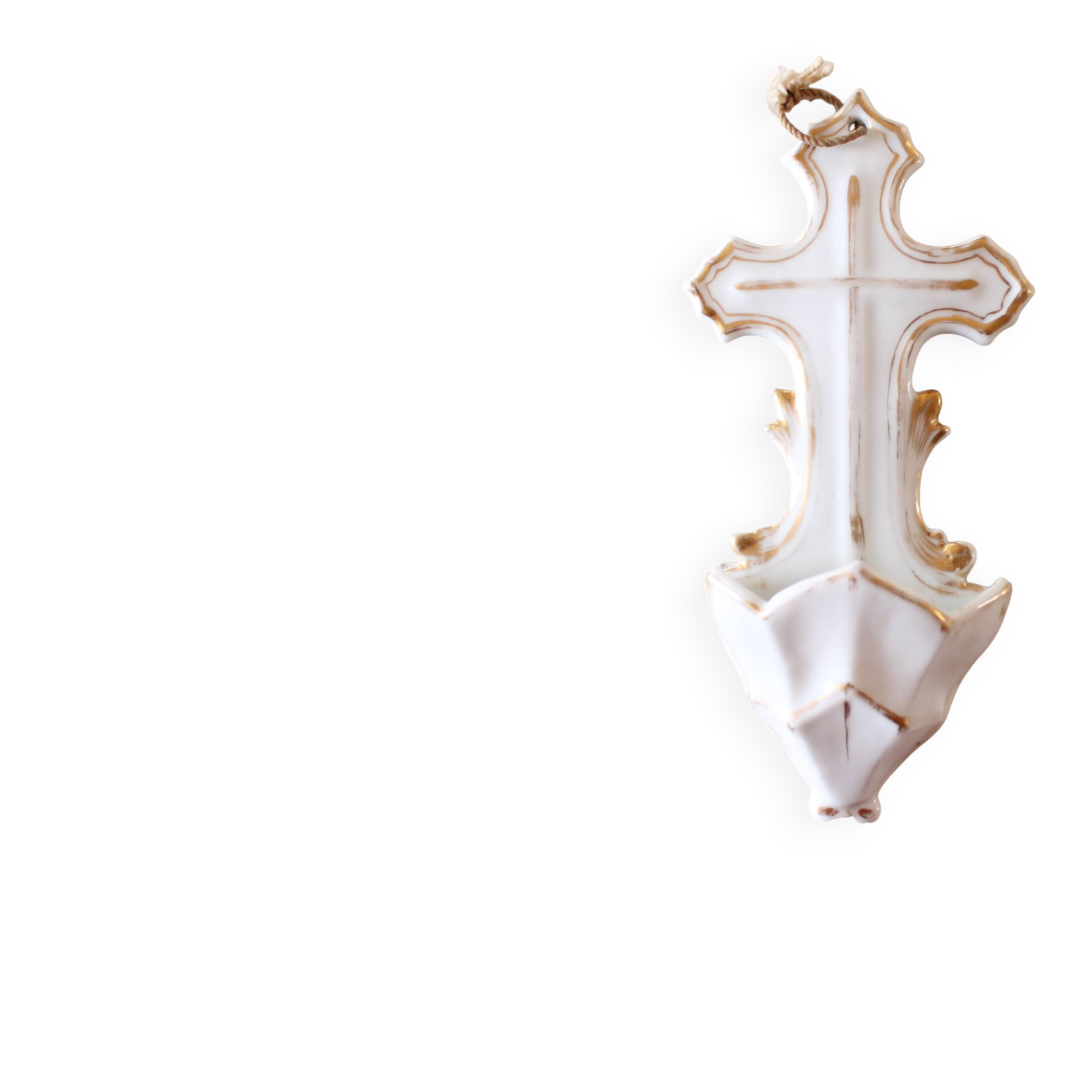 Antique holy water font in white porcelain biscuit.