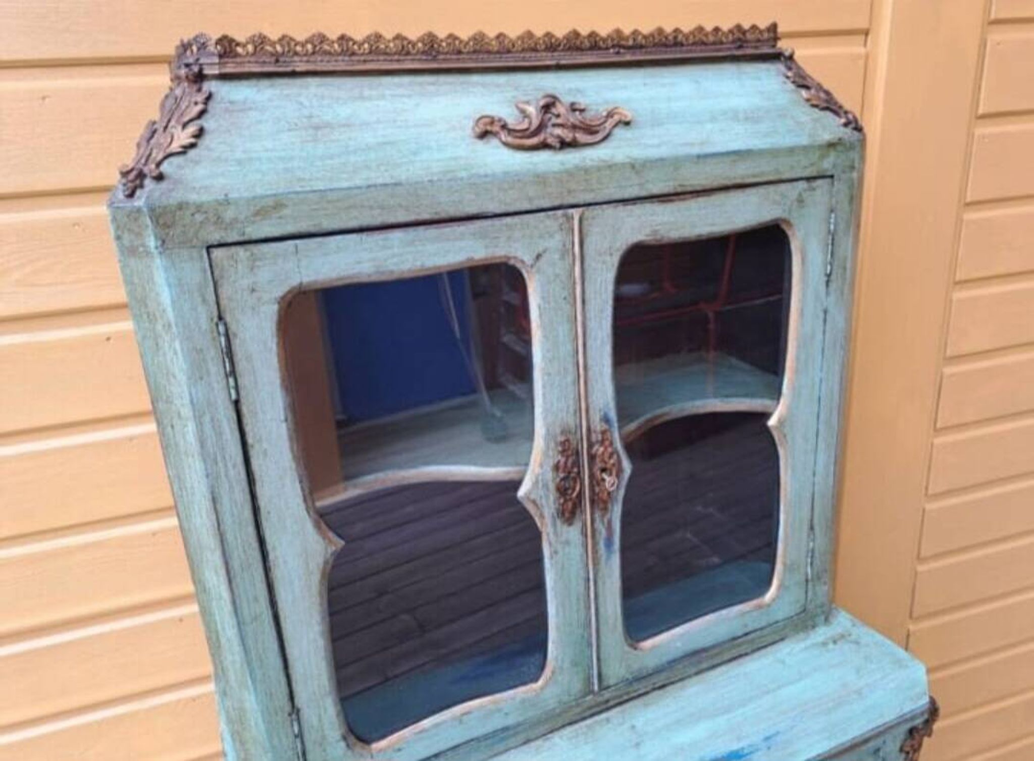 Blue patinated wooden display cabinet