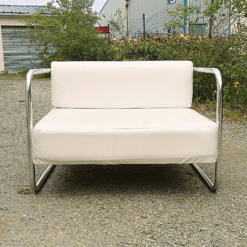 Chrome-designed chair and faux white leather 1970