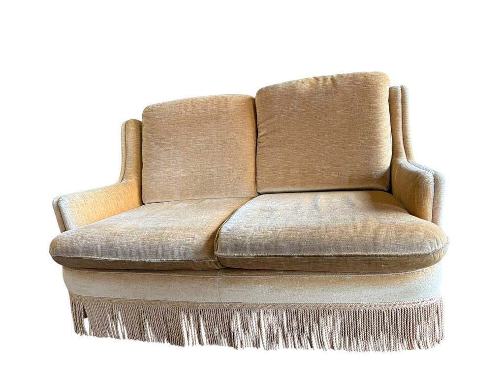 Vintage beige two-seater sofa with fringes