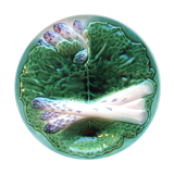 Asparagus plate in dabbling, with a leaf of green cabbage