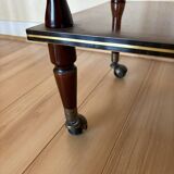 Vintage side table in varnished wood, with casters and gold threads