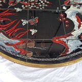 Round coffee table with Japanese bird and flower decor