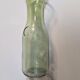 Old green milk bottle