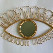 Rattan eye mirror