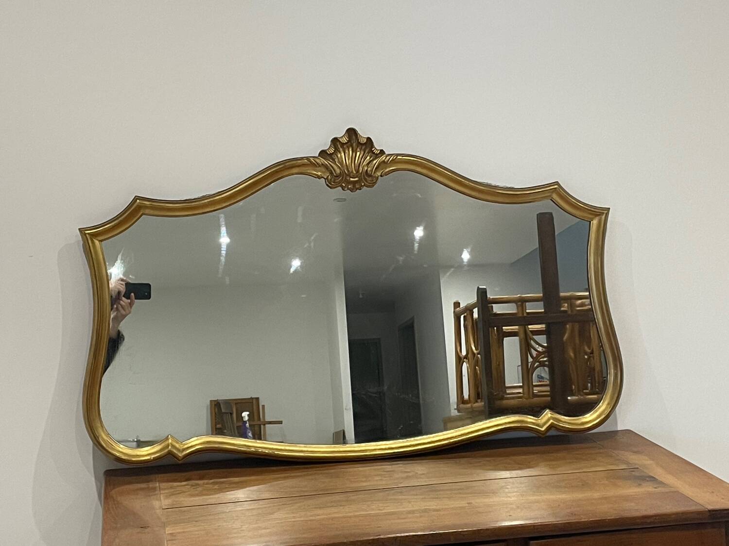 Large vintage mirror with an animated shape and Louis XV baroque style shell
