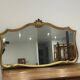 Large vintage mirror with an animated shape and Louis XV baroque style shell