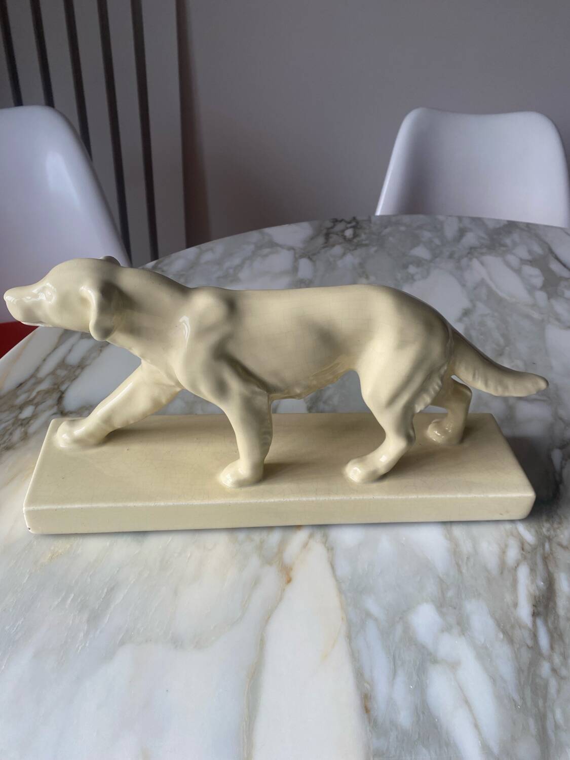 Ceramic of a walking dog brand Odyv