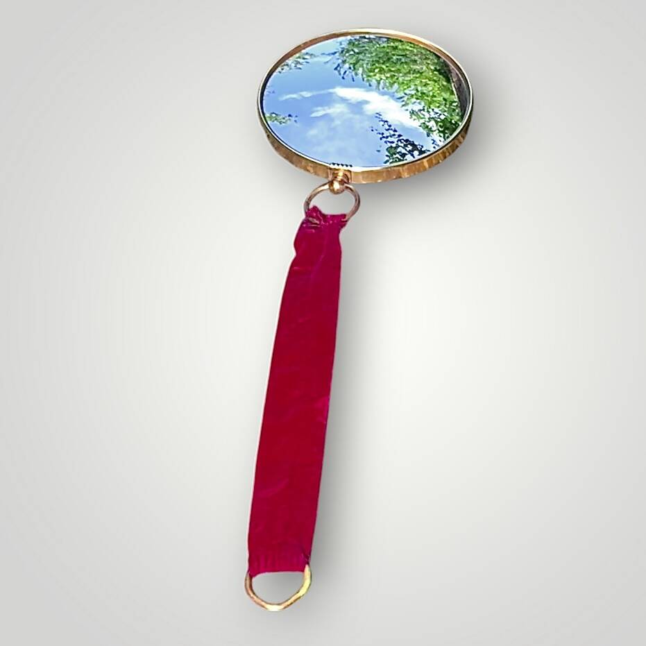 Antique convex "witch's eye" mirror