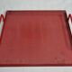 Presentation tray in red lacquered perforated metal, 80s
