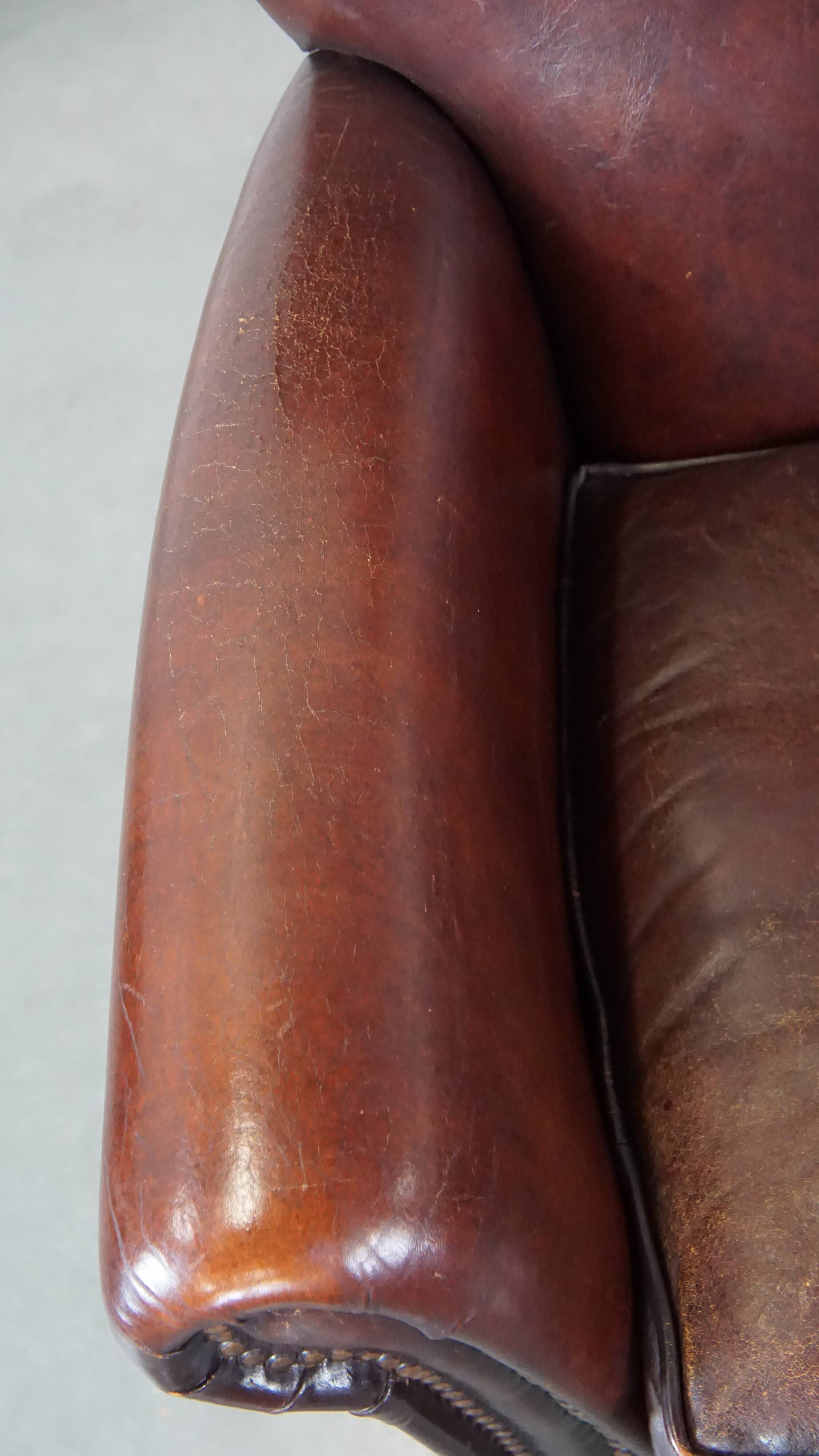 Sheep leather armchair correctly finished with decorative nails