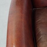 Sheep leather armchair correctly finished with decorative nails