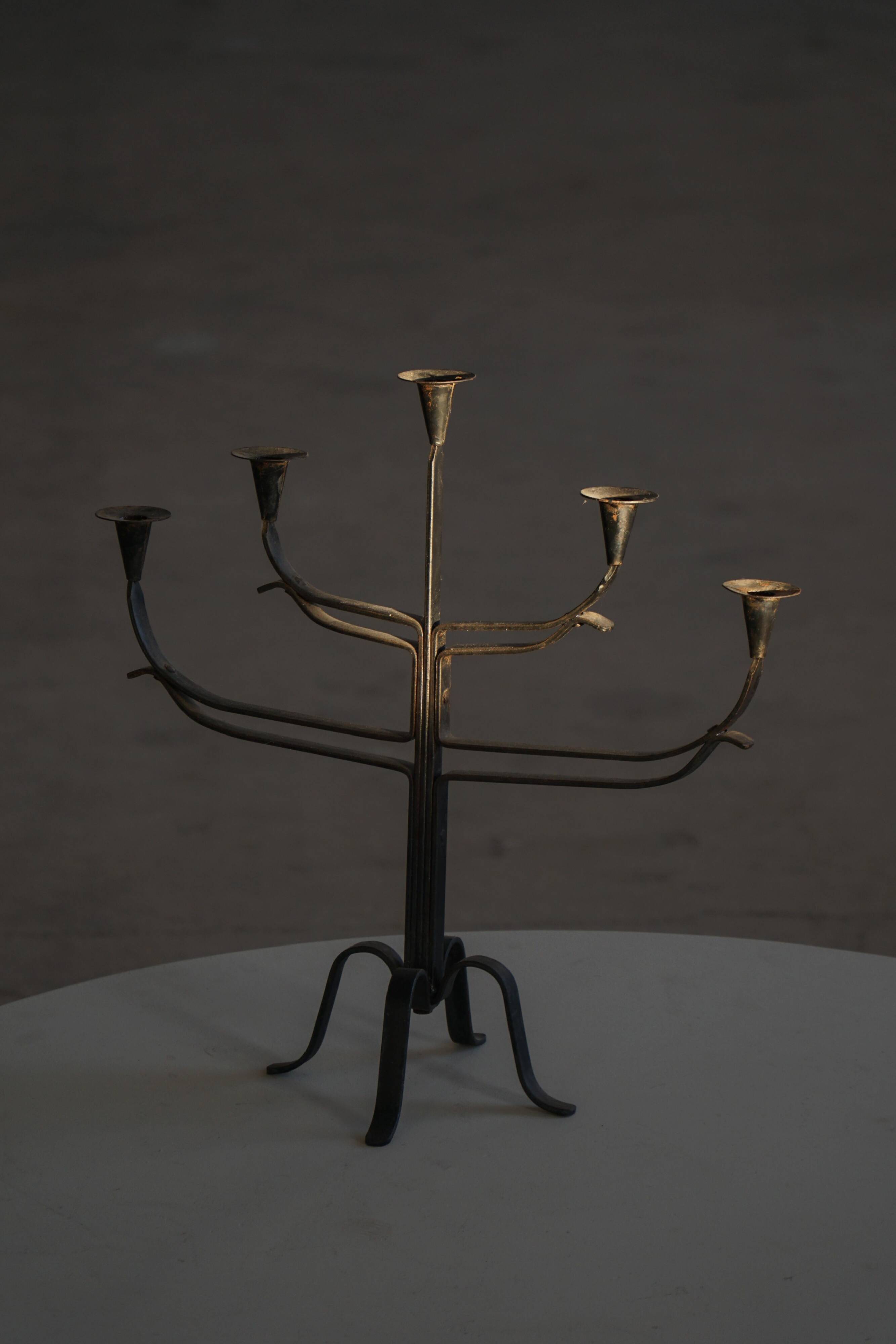 Brutalist Scandinavian candlestick in wrought iron and metal from the mid-20th century.