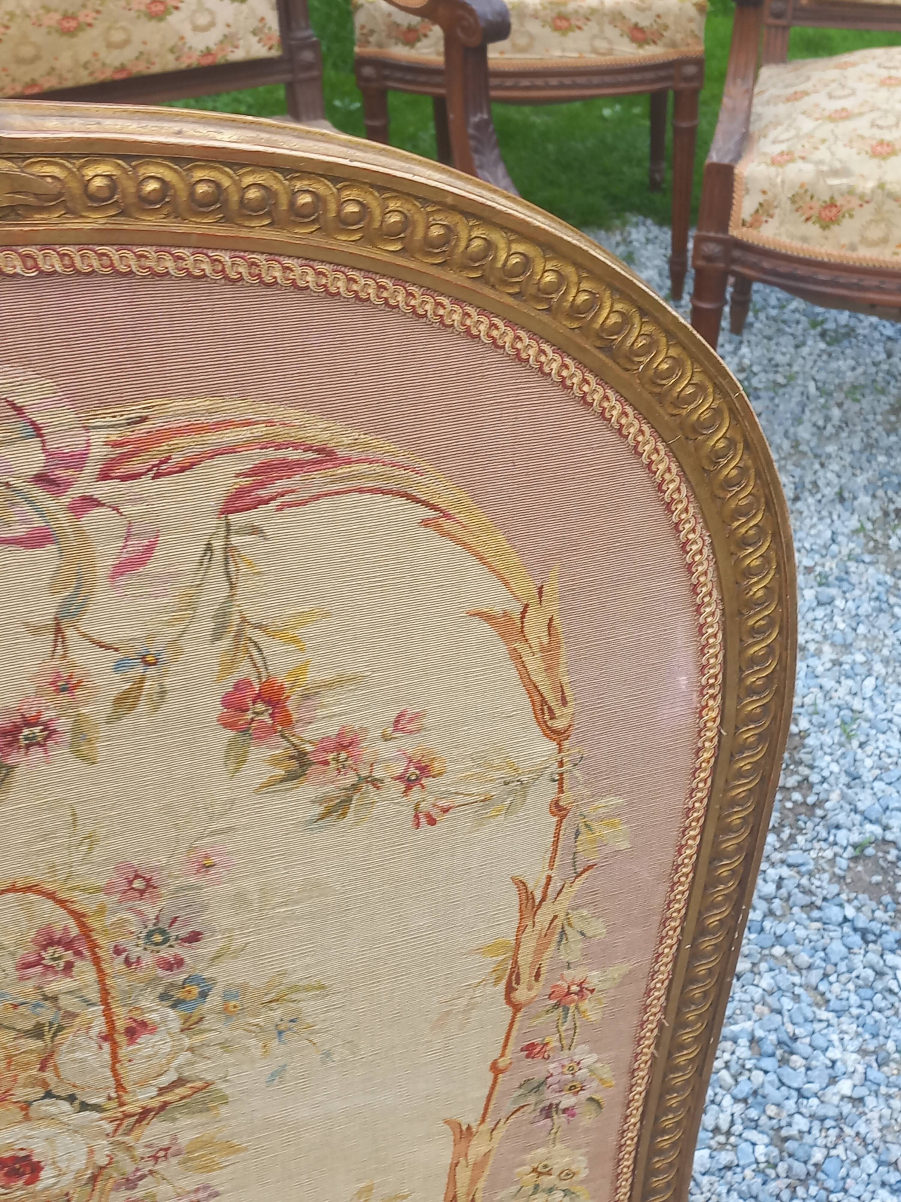 Golden wooden fireplace screen and Aubusson tapestry, 19th century.