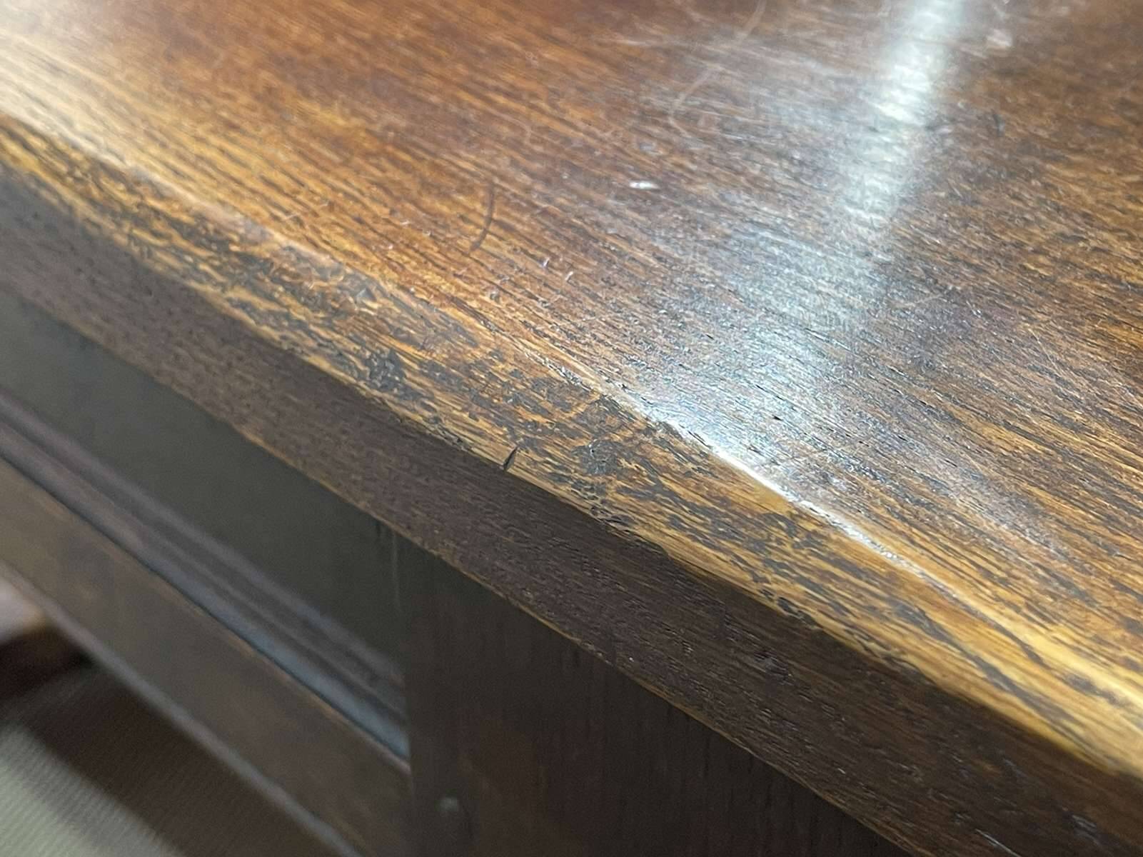 English monastery table with extensions from the late 19th century in elm and oak.