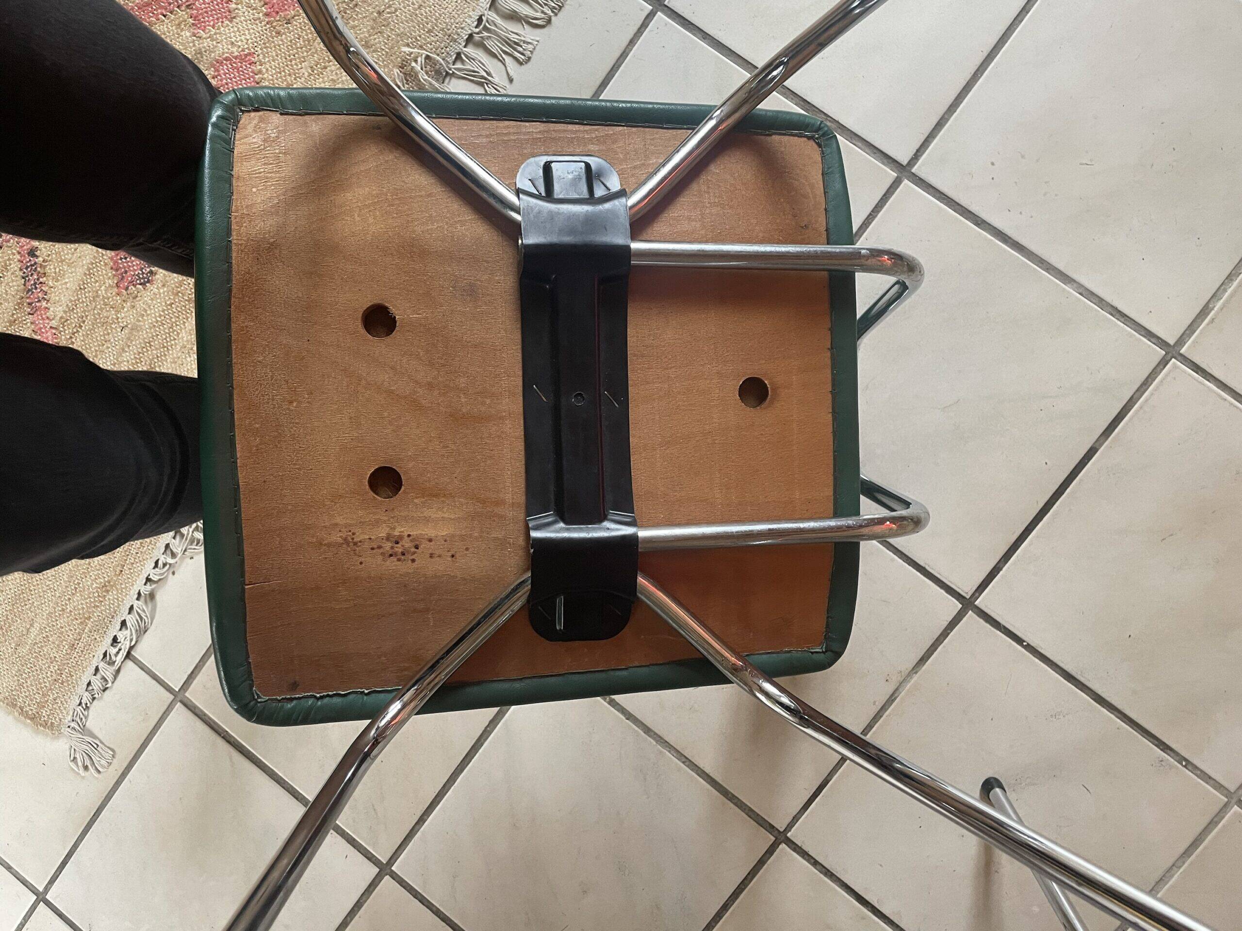 Pair of green faux leather chairs