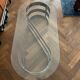 70s design oval coffee table in glass with chrome legs.