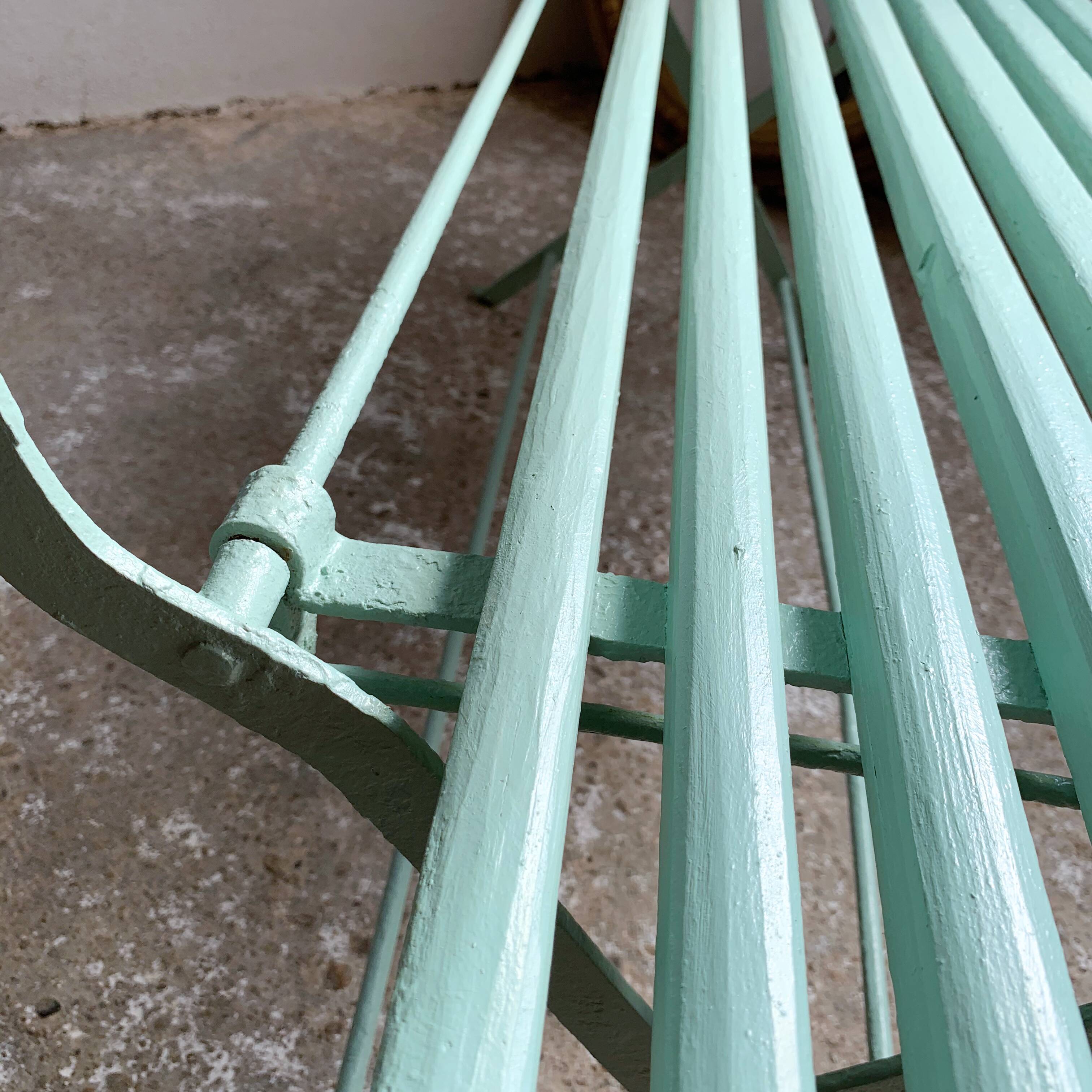 Former folding garden bench with wooden and metal slats