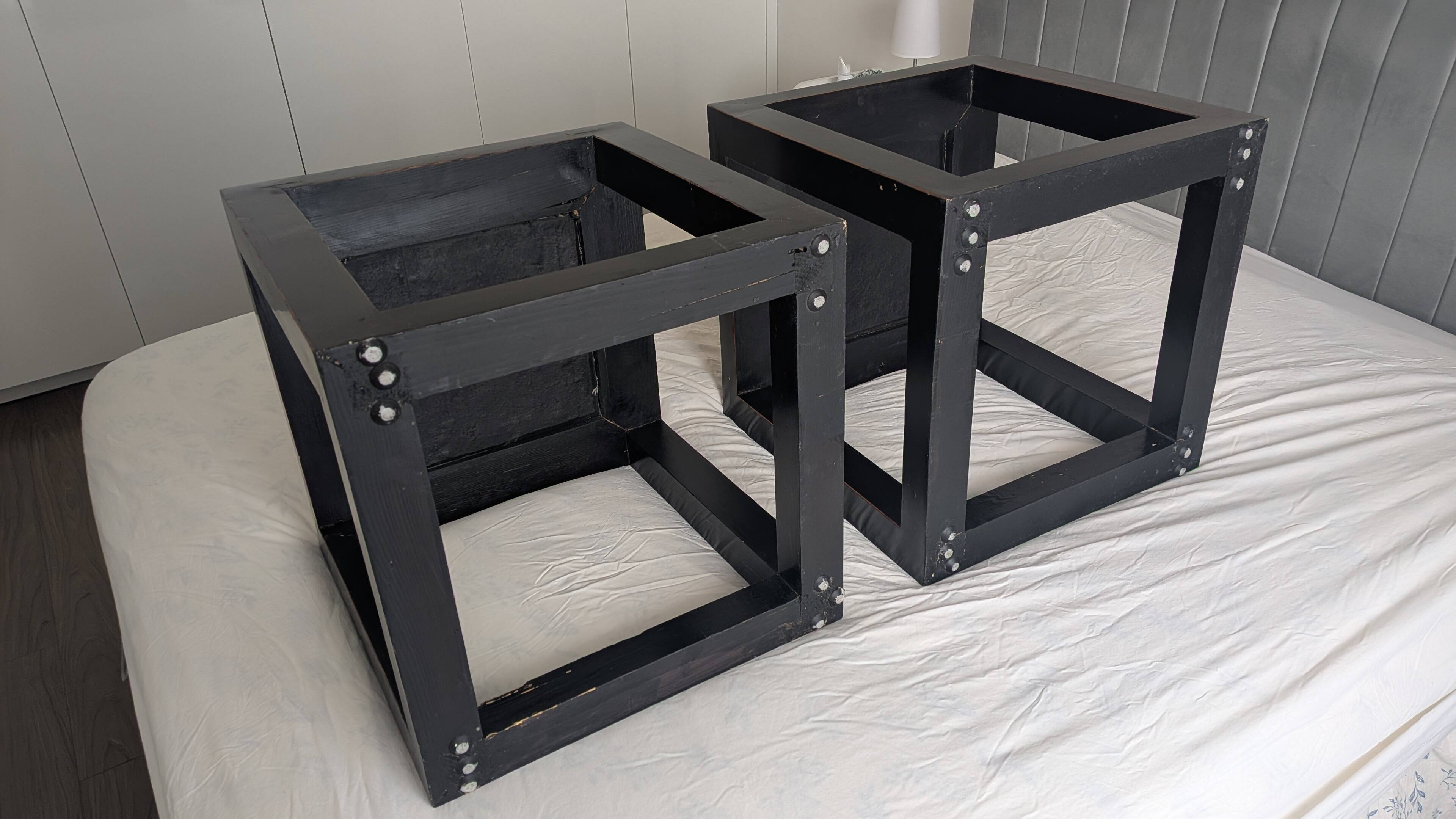 Chinese side tables in black lacquer, stone top.