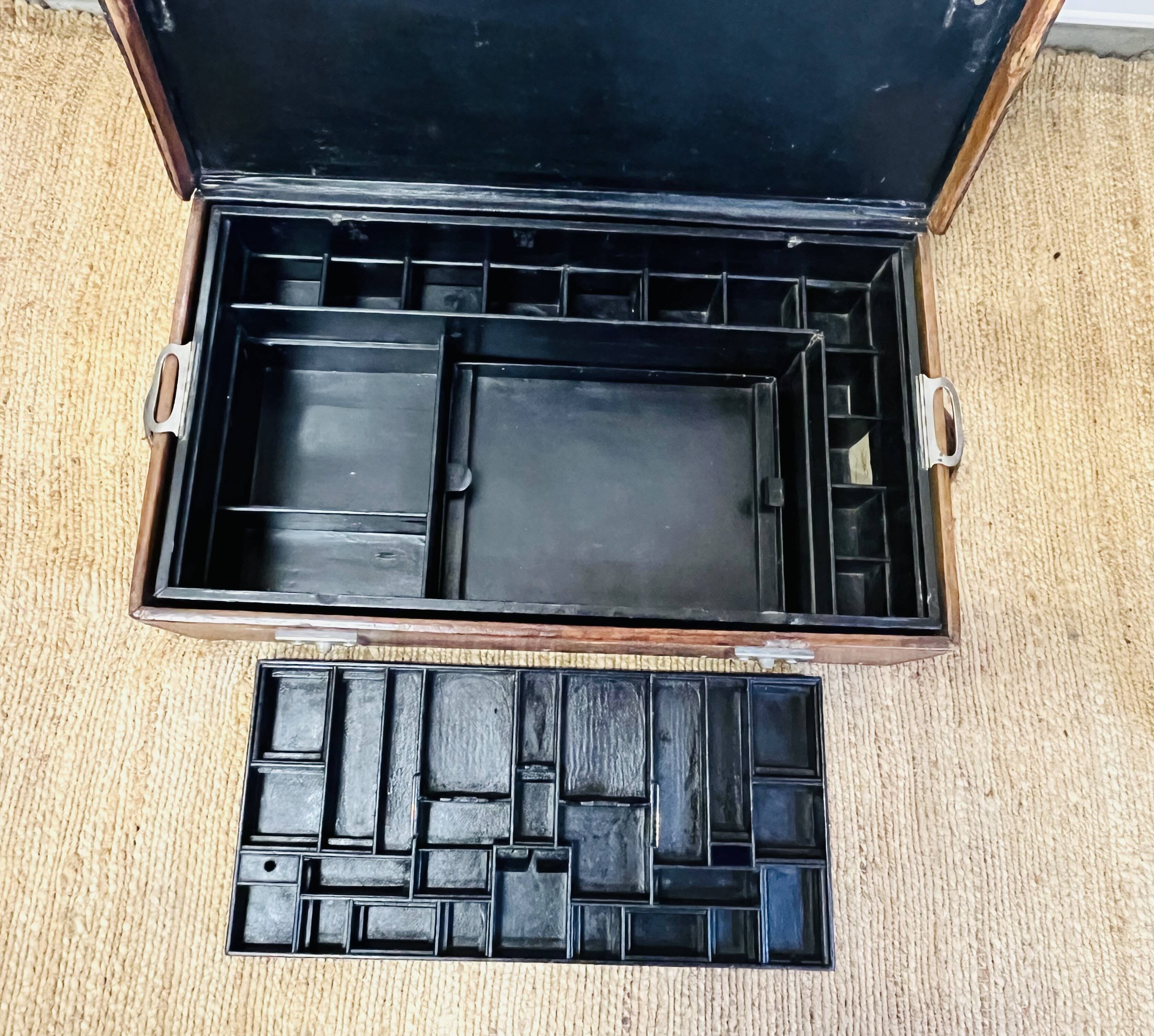 Large Gustave Keller leather trunk with multiple compartments