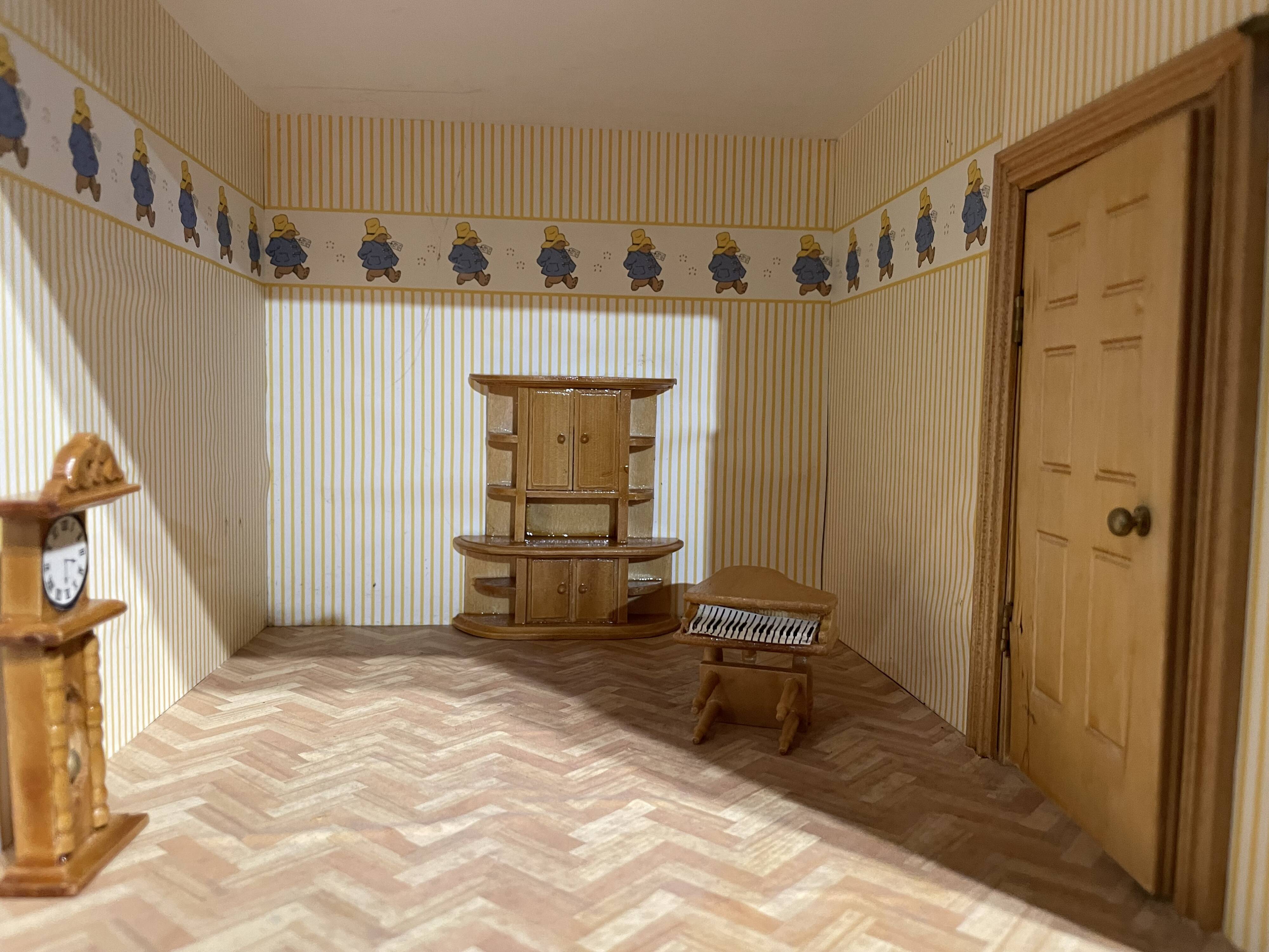 Large wooden dollhouse with miniature furniture