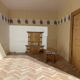 Large wooden dollhouse with miniature furniture