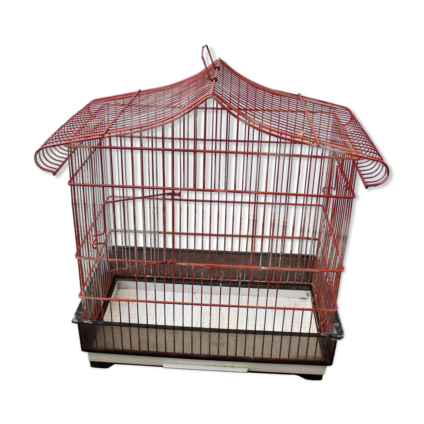 Old red metal birdcage