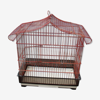 Old red metal birdcage