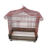 Old red metal birdcage