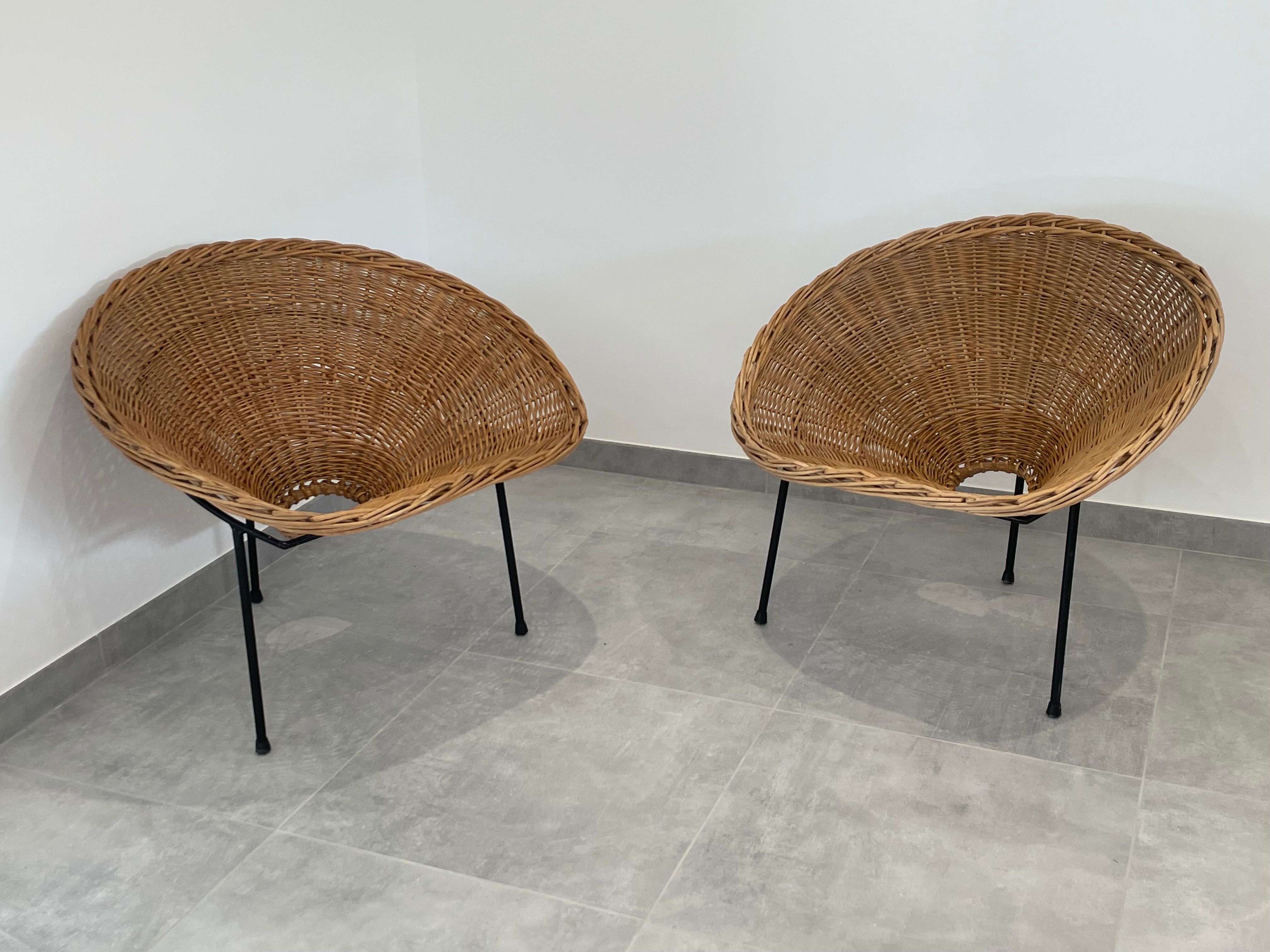 Pair of rattan and black metal armchairs, 1950s/60s