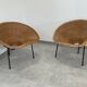 Pair of rattan and black metal armchairs, 1950s/60s