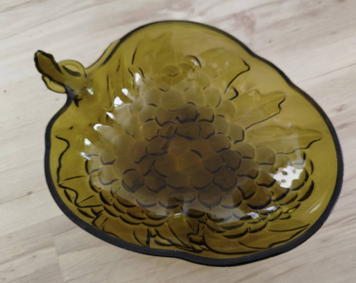 Indian green glass fruit bowl with grape decoration in strawberry shape.