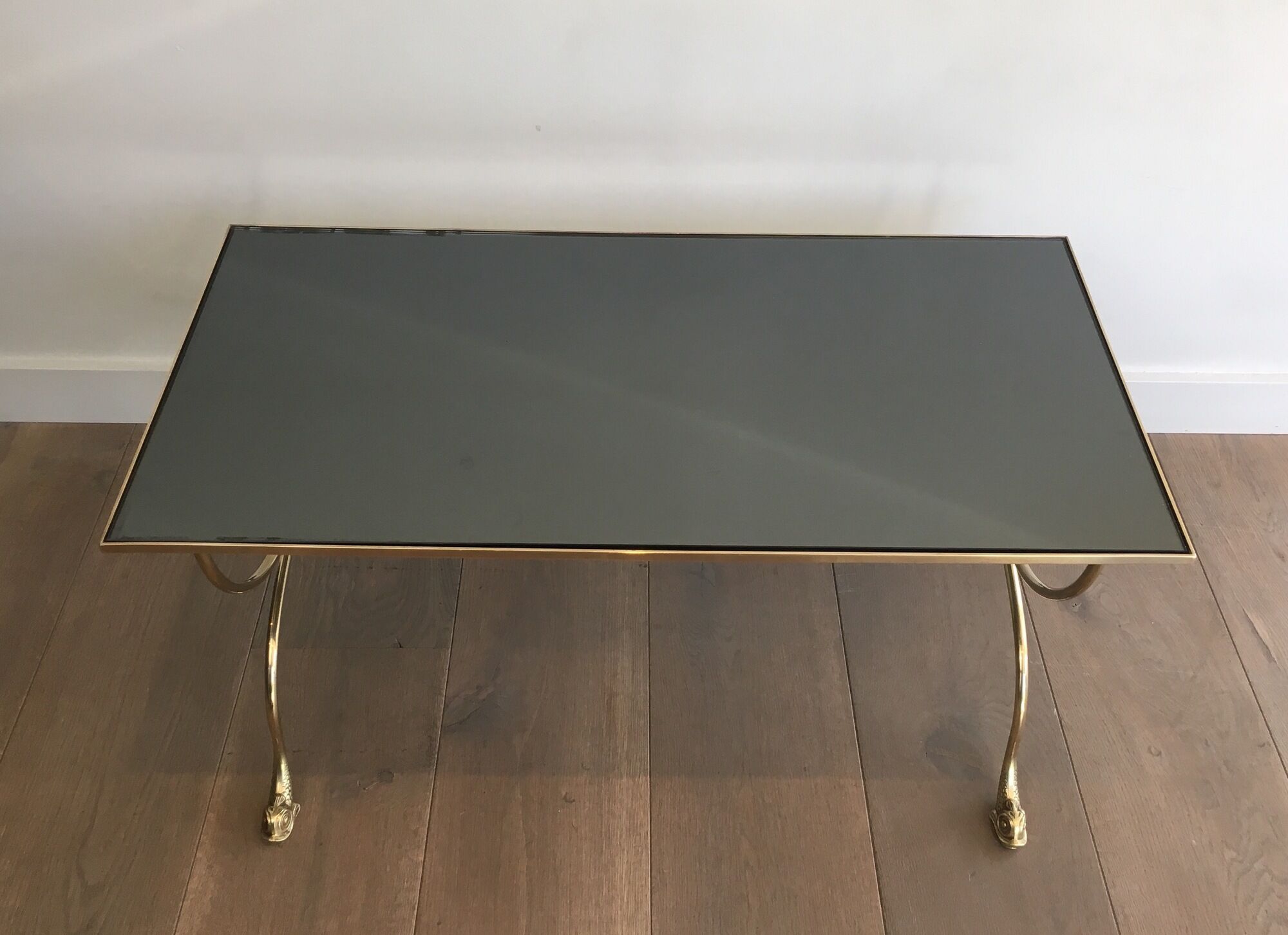 Neoclassical brass style coffee table with dolphin head decoration