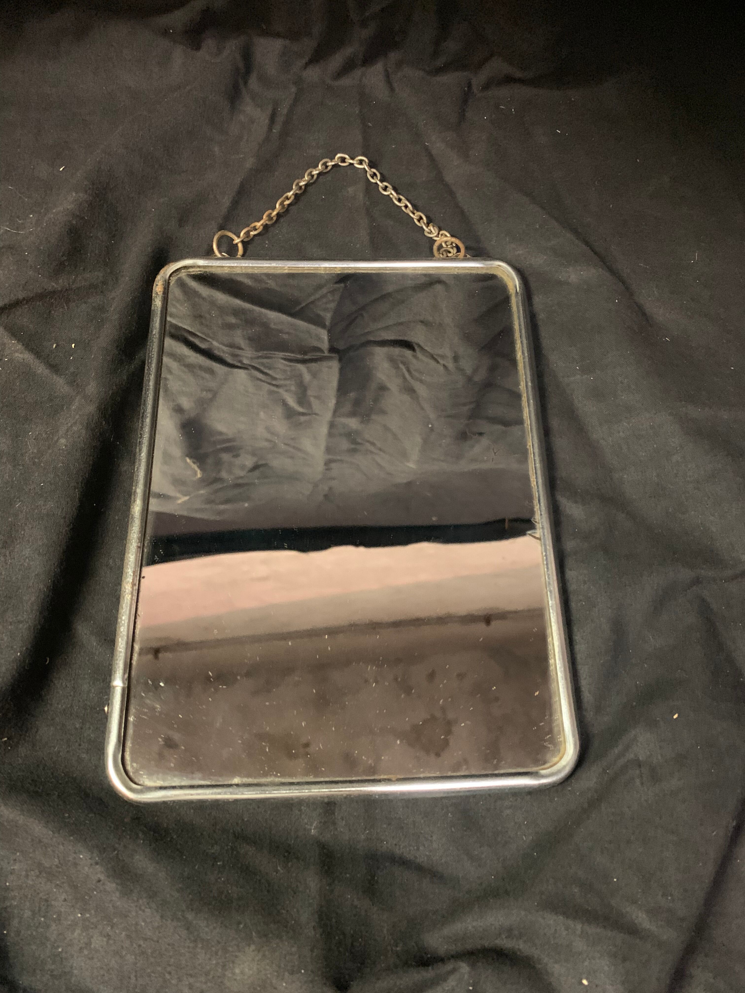 Old barber mirror with chain