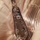 12 silver-plated cutlery sets with floral decoration
