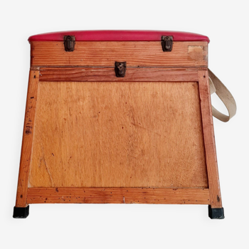 Old fisherman's stool with red seat