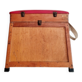 Old fisherman's stool with red seat