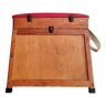 Old fisherman's stool with red seat